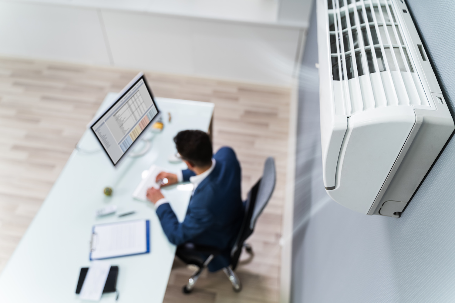 Businessman Enjoying The Cooling Of Air Conditioner